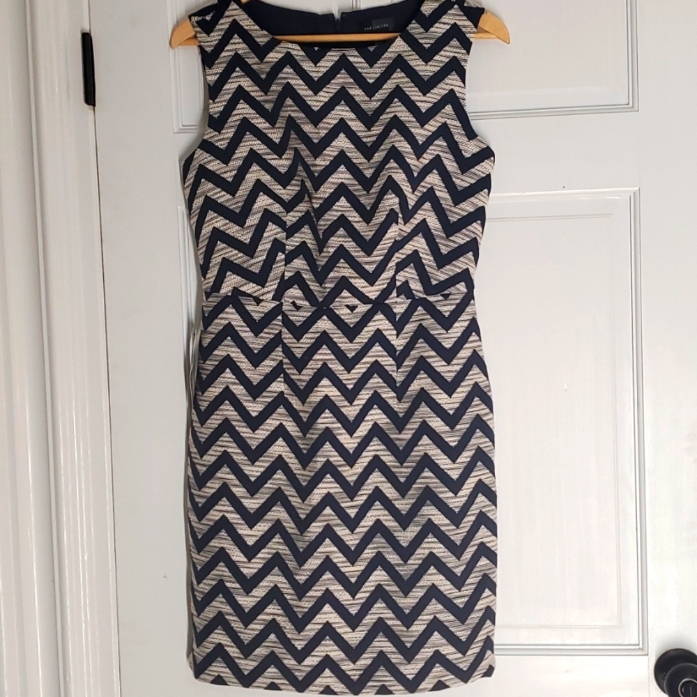 The limited dress size 2 Brand New with tag. Navy Blue with white color